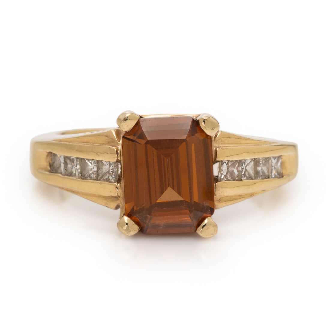 Yellow Gold, Zircon, and Diamond Ring: Yellow Gold, Zircon, and Diamond Ring Emerald cut zircon and channel-set princess cut diamonds. 14 karat yellow gold. Ring size 6 3/4. Stamp: 14K. Gross weight: 3.75 dwt. From the Private Collection o