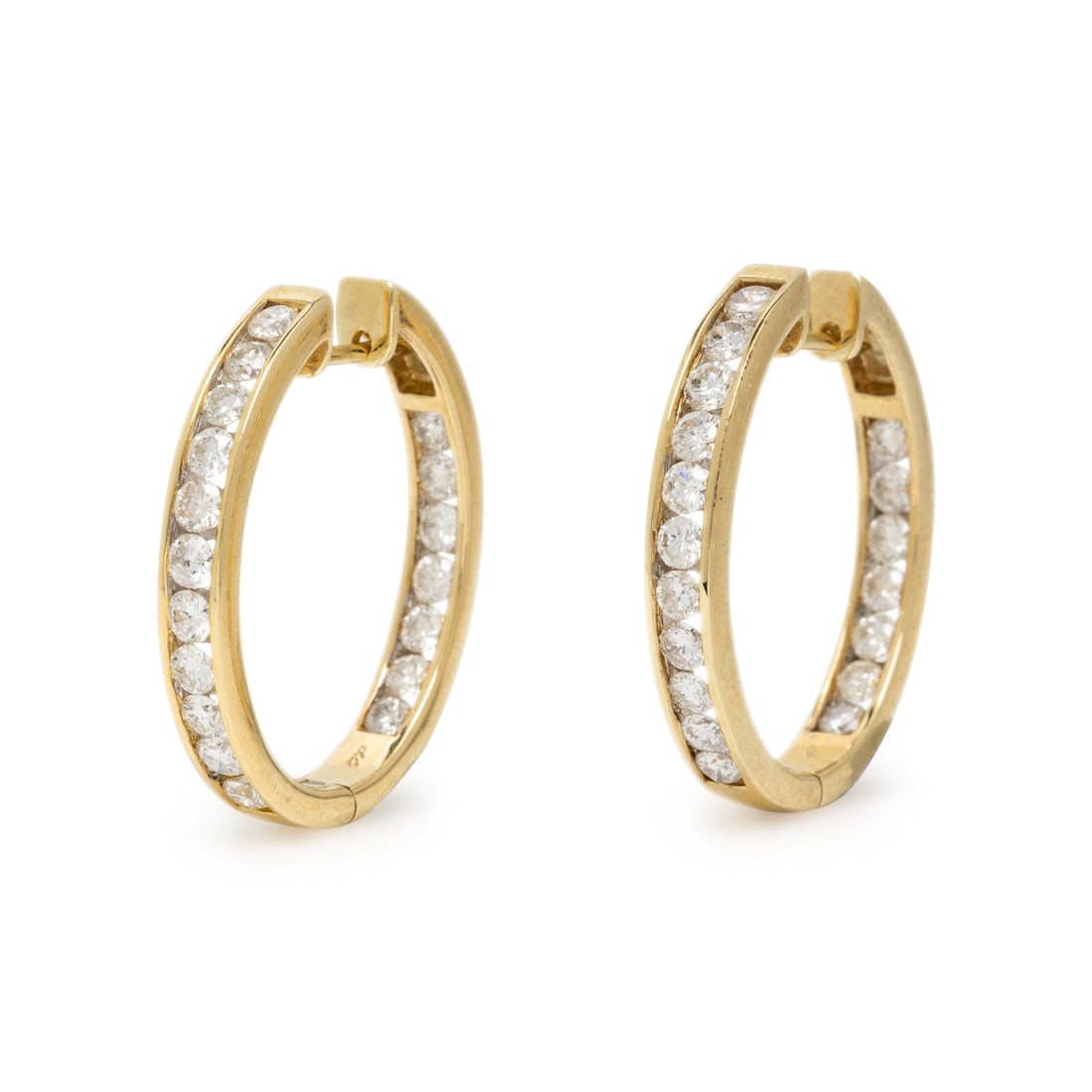 Diamond and Yellow Gold Inside Out Hoop Earrings: Diamond and Yellow Gold Inside Out Hoop Earrings Round diamonds weighing approximately 2.20 carats total, and one colorless crystal. 14 karat yellow gold. 1 inch long. Stamp: 14K 585 (maker's mark). G