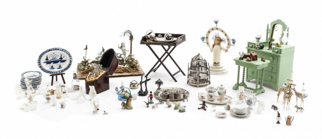 A Collection of Miniatures, Height of first 5 1/2: A Collection of Miniatures, comprising a painted dresser, a bed, a side table, various sterling silver objects, an assembled porcelain tea service, a birdcage, dinner plates, and various diminutive an