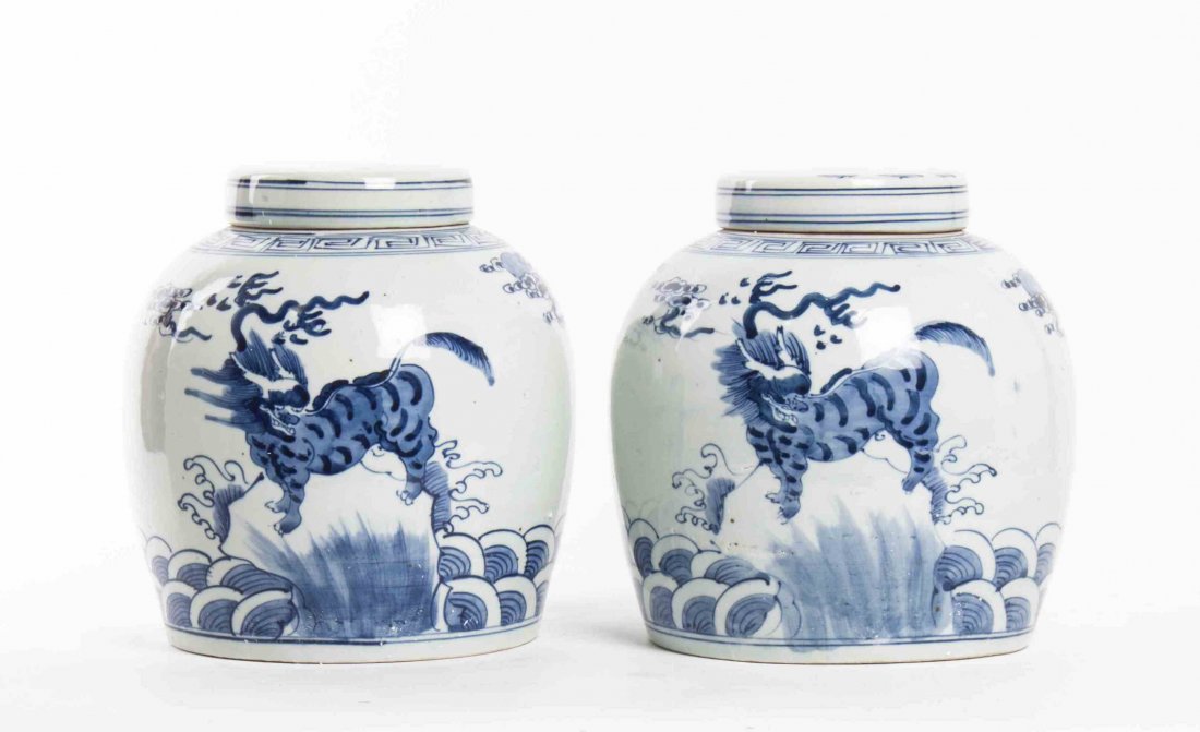 A Pair of Chinese Porcelain Ginger Jars, Height 9: A Pair of Chinese Porcelain Ginger Jars, having underglaze blue decoration of dragons, having key-fret decoration to the shoulder, with porcelain lids. Height 9 inches.