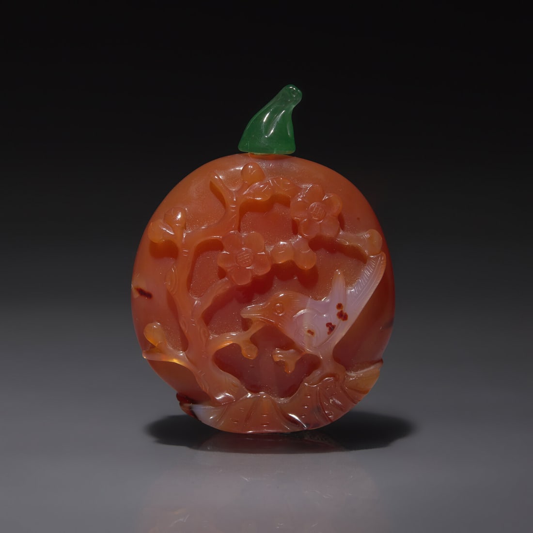 A Chinese Carved Carnelian Snuff Bottle, Late Qing Dynasty: A Chinese Carved Carnelian Snuff Bottle, Late Qing Dynasty 清晚期 瑪瑙雕花鳥壽桃圖鼻煙壺 Late Qing Dynasty Of flatte