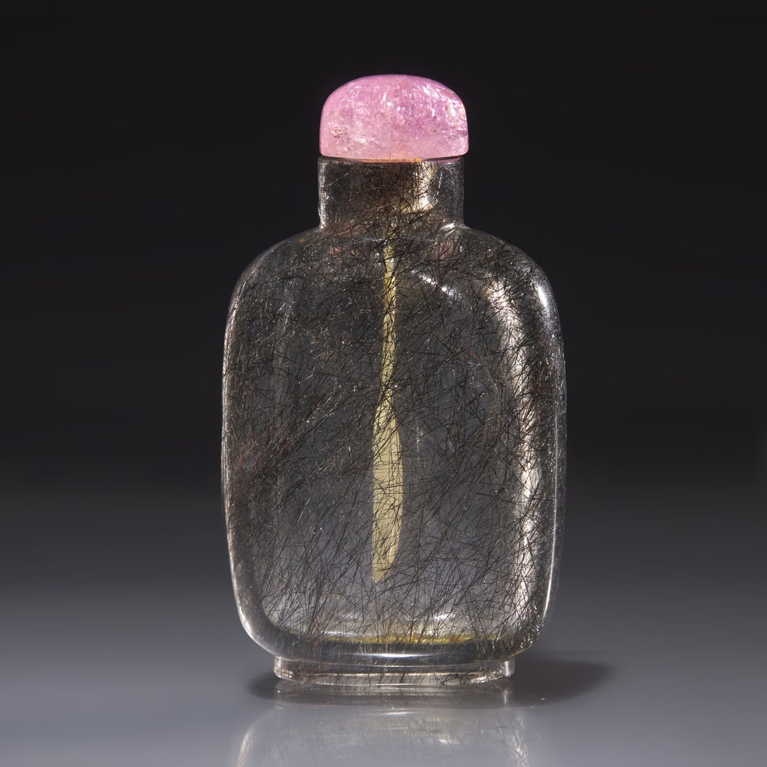 A Chinese "Hair Crystal" Snuff Bottle, Qing Dynasty, Circa 1740-1850: A Chinese "Hair Crystal" Snuff Bottle, Qing Dynasty, Circa 1740-1850 1740–1850年 髮晶素面鼻煙壺 Circa 1740-1850 The colorless crystal with inclusi
