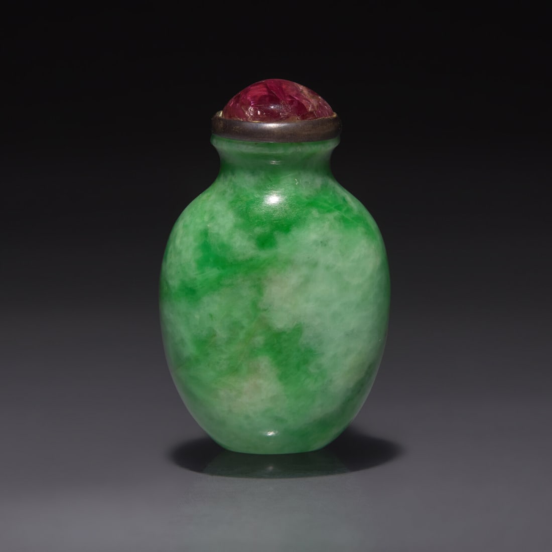 A Small Chinese Jadeite Snuff Bottle, Qing Dynasty, 19th Century: A Small Chinese Jadeite Snuff Bottle, Qing Dynasty, 19th Century 清晚期 翡翠小鼻煙壺 19th Century Of slightly flattened tapered ovoid form, with w