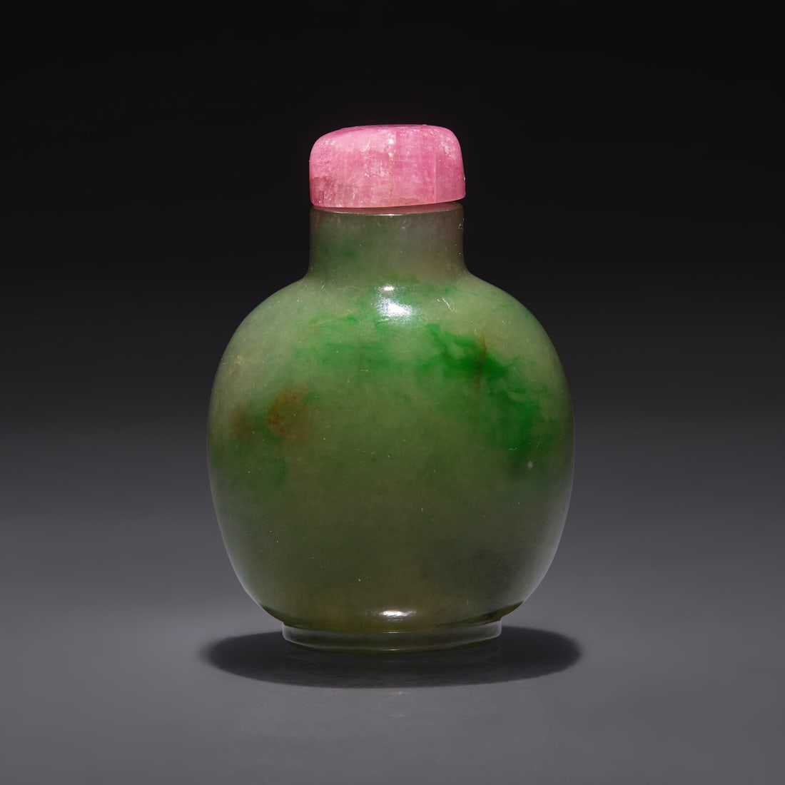 A Chinese Jadeite Snuff Bottle, Qing Dynasty, 19th/20th century: A Chinese Jadeite Snuff Bottle, Qing Dynasty, 19th/20th century 清晚期 翡翠鼻煙壺 19th/20th century Of slightly flattened globular for, with sloping sho