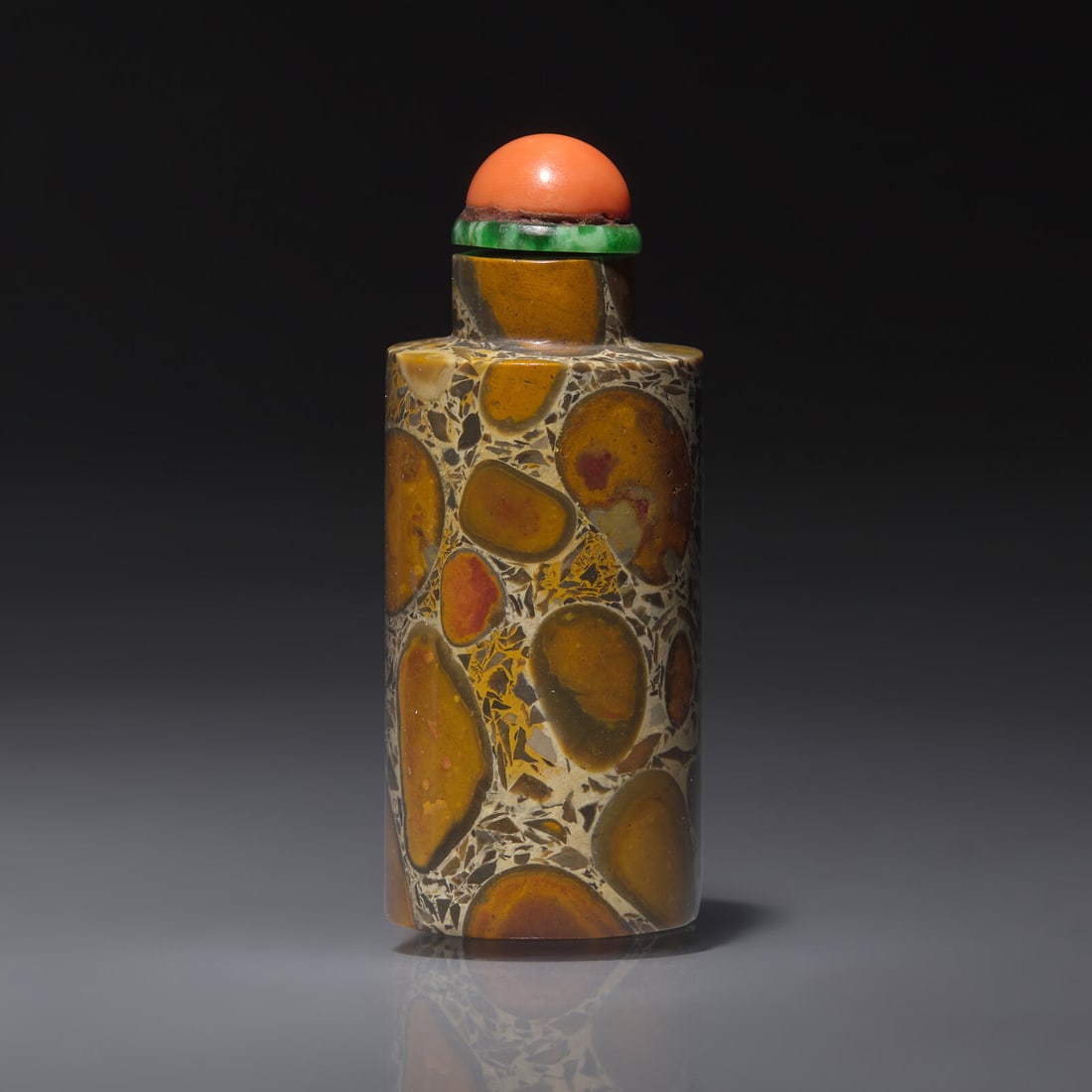 A Chinese Puddingstone Snuff Bottle, Qing Dynasty, Circa 1760-1880: A Chinese Puddingstone Snuff Bottle, Qing Dynasty, Circa 1760-1880 1760-1880年 抱子石素面鼻煙壺 Circa 1760-1880 Possibly Imperial, of cylindrical 