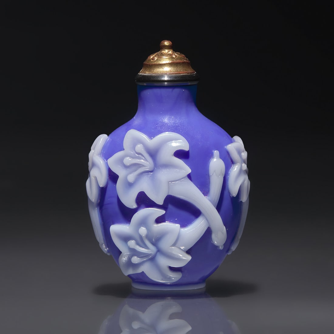 A Chinese White Overlaid Blue Glass Snuff Bottle, Qing Dynasty, 18th Century (1 of 2)