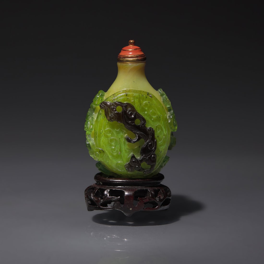 A Chinese Double-Overlay Glass Snuff Bottle, Qing Dynasty, Late 18th/Early 19th Century: A Chinese Double-Overlay Glass Snuff Bottle, Qing Dynasty, Late 18th/Early 19th Century 清中期 淡黃地套綠黑料螭龍紋鼻