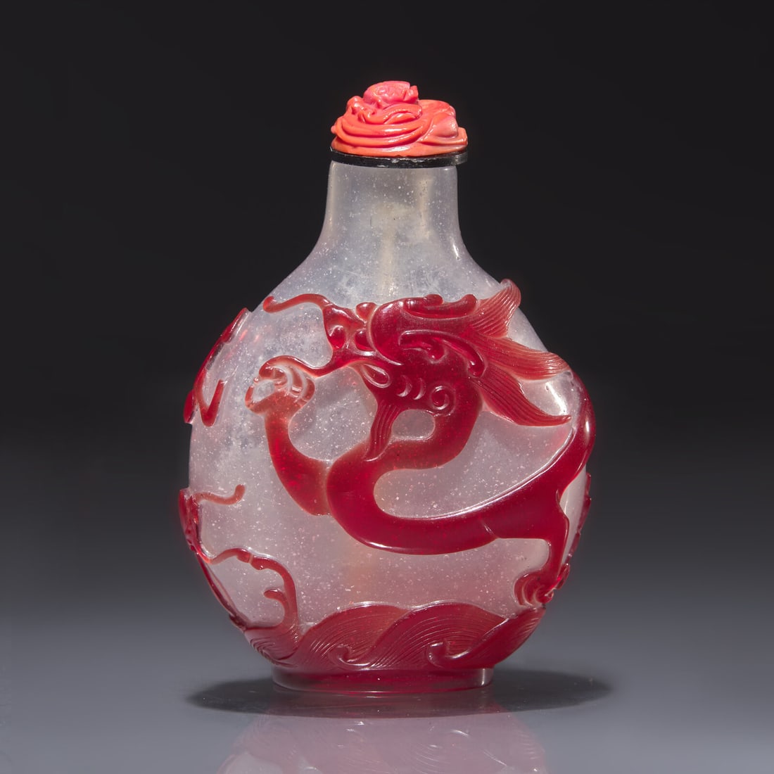 A Chinese Ruby Overlay Glass "Dragon" Snuff Bottle, Qing Dynasty, 18th Century (1 of 2)