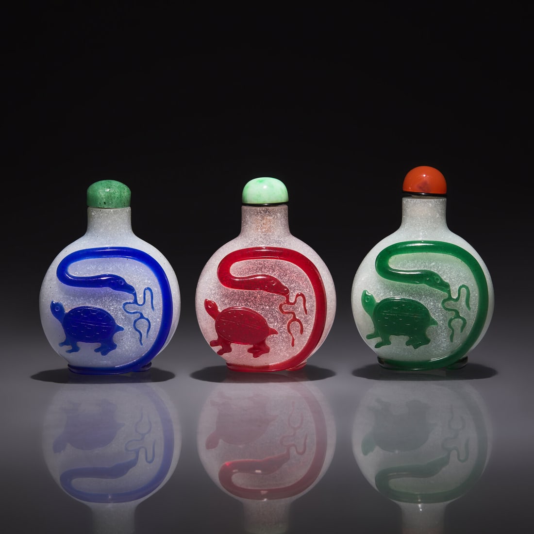 Three Chinese Overlay Glass "Xuanwu" Snuff Bottles, Qing Dynasty, 18th/19th Century: Three Chinese Overlay Glass "Xuanwu" Snuff Bottles, Qing Dynasty, 18th/19th Century 清中晚期 雪霏地套料鼻煙壺三支 18