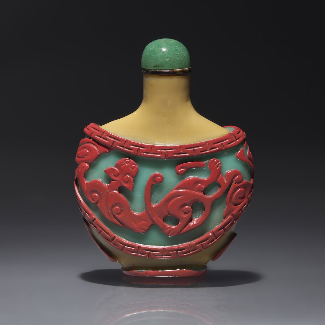 A Chinese Carved Double Overlay Glass Snuff Bottle, Qing Dynasty, Circa 1800-1880: A Chinese Carved Double Overlay Glass Snuff Bottle, Qing Dynasty, Circa 1800-1880 1800-1880年 褐地套紅綠料螭龍紋鼻煙壺 Cir