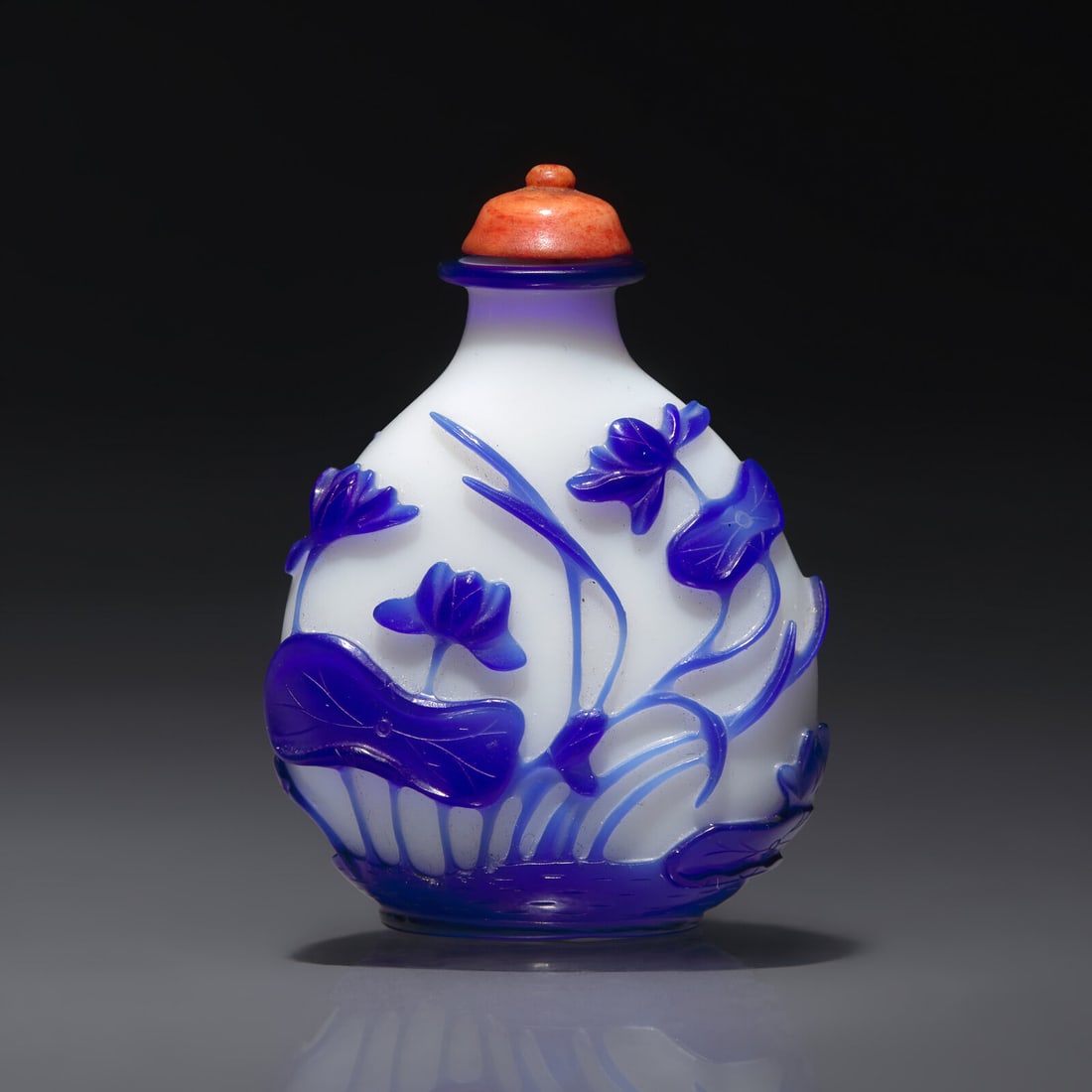 A Chinese Glass Overlay "Lotus" Snuff Bottle, Qing Dynasty, Circa 1750-1795 (1 of 2)