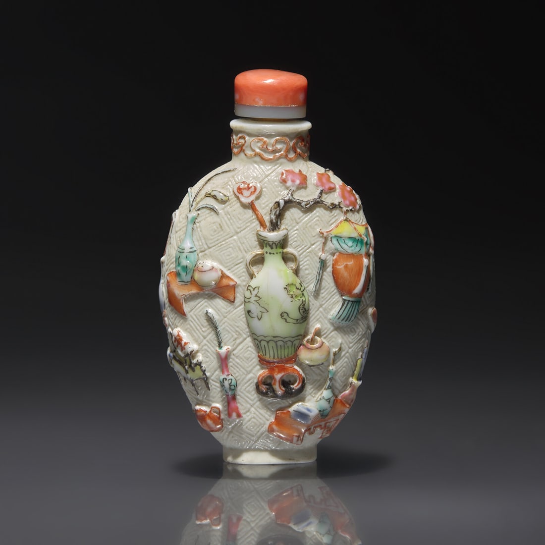 A Chinese Molded and Enameled "Bo Gu Tu" Porcelain Snuff Bottle, Qianlong Mark and of the Period (1 of 3)