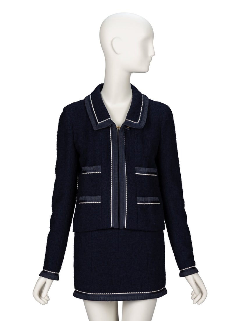 Chanel, Navy Bouclé Tweed Suit: Chanel, Navy Bouclé Tweed Suit As seen in runway look #116 of the Spring/Summer 1994 ready-to-wear collection by Karl Lagerfeld for Chanel. JACKET Open-front slightly cropped jacket in navy wool