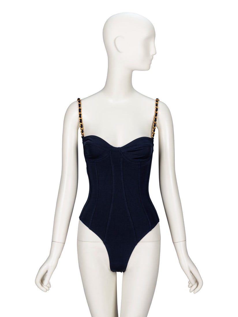 Chanel, Chain Strap Swimsuit: Chanel, Chain Strap Swimsuit One-piece swimsuit in deep navy stretch-blend nylon knit. Straps are gold-tone metal chain with interwoven knit material. Sweetheart neckline with underwired bra cups.
