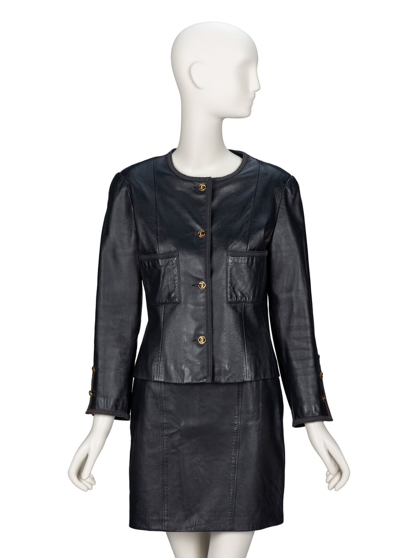 Chanel, Leather Skirt Suit: Chanel, Leather Skirt Suit JACKET Fitted cardigan jacket in deep midnight blue lambskin leather with tonal braided trim throughout. Collarless round neckline. Light padding at shoulders. Wrist-length 