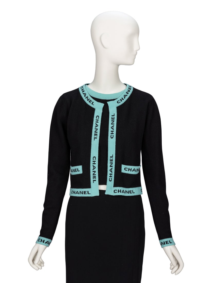 Chanel, Logo Knit Cashmere Twinset, 1994: Chanel, Logo Knit Cashmere Twinset, 1994 CARDIGAN Open-front cardigan in black and turquoise cashmere knit. Features 'CHANEL' logo intarsia knit at edges. Round collarless neckline. Full-length