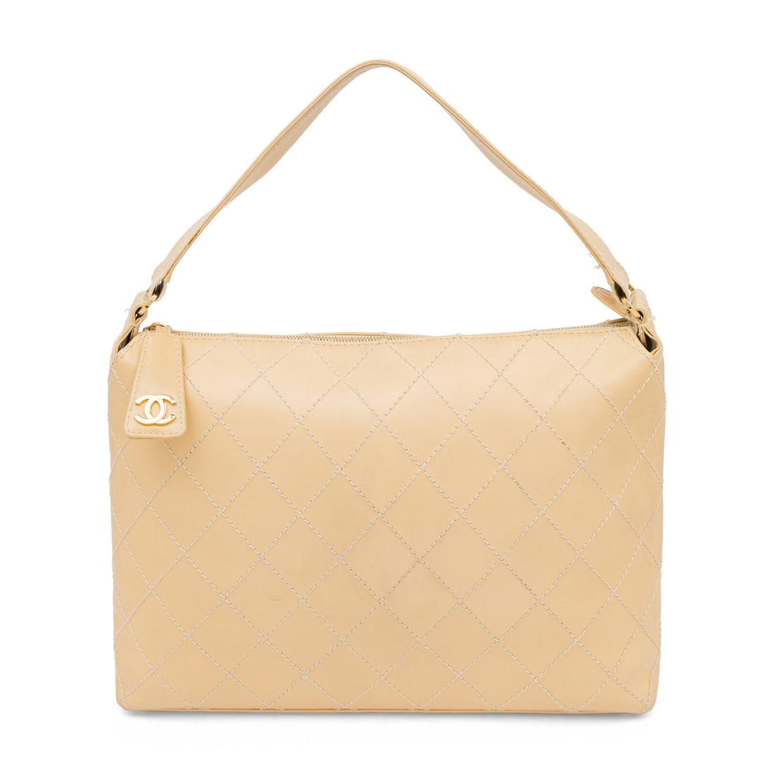 Chanel, Beige Topstitched Leather Bag: Chanel, Beige Topstitched Leather Bag Wild Stitch Surpique Hobo bag in smooth beige leather with cream diamond topstitching with gold-tone hardware. Zipper closure and flat leather strap. Label: Chane