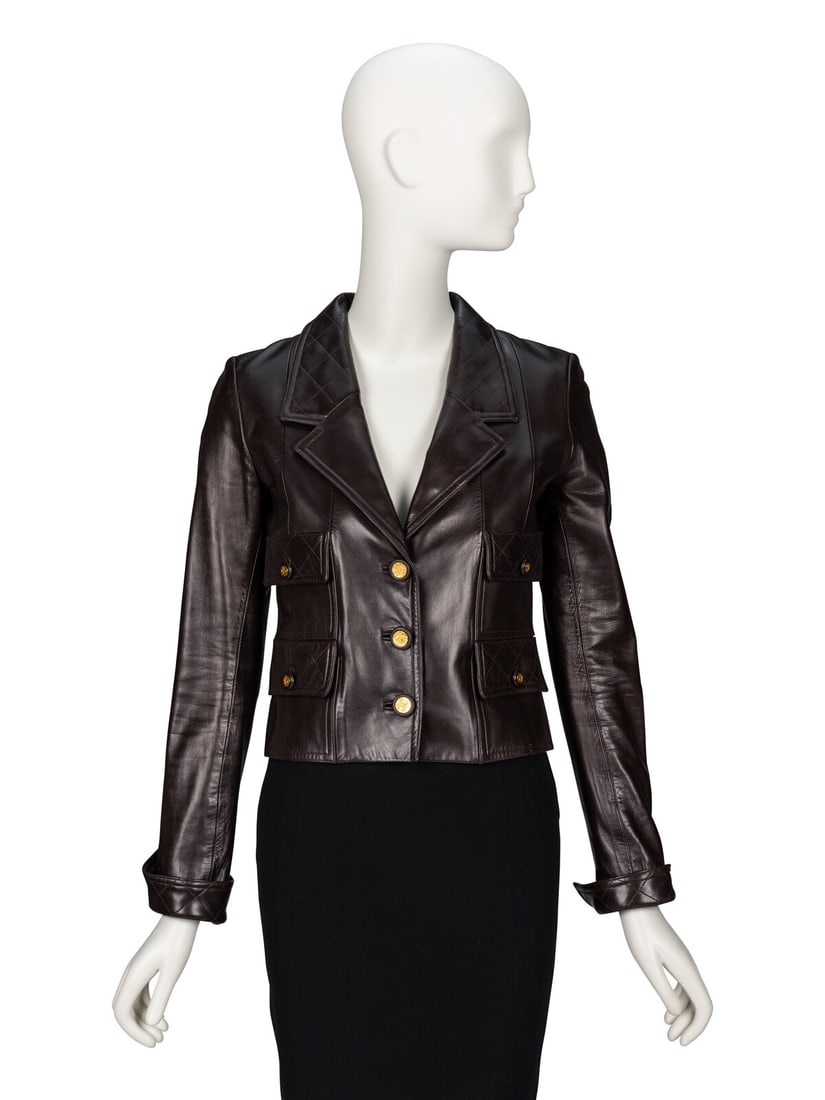 Chanel, Chocolate Brown Leather Jacket, 1993: Chanel, Chocolate Brown Leather Jacket, 1993 Slightly cropped jacket in glossy chocolate brown lambskin leather. Diamond topstitching details at collar, cuffs, and pocket flaps. Notched lapels.