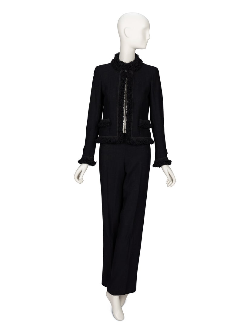 Chanel, Lightweight Black Tweed Pantsuit: Chanel, Lightweight Black Tweed Pantsuit JACKET Jacket in a black lightweight tropical wool tweed with curly fringe trim throughout. Stand collar. Light padding at shoulders. Full-length set-in