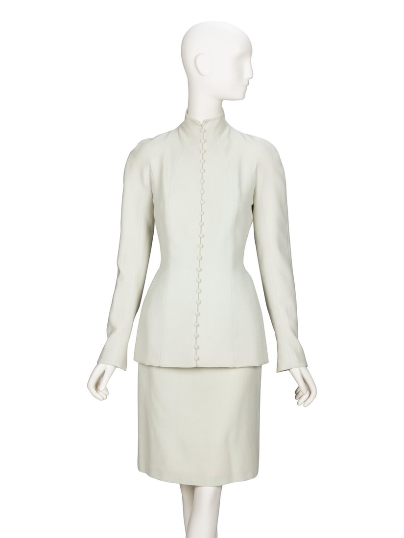 John Galliano, Pale Mint Green Skirt Suit: John Galliano, Pale Mint Green Skirt Suit JACKET Fitted hourglass jacket in pale mint green wool crÍpe. Incorporated stand collar. Incorporated full-length sleeves; slit openings with button & loop