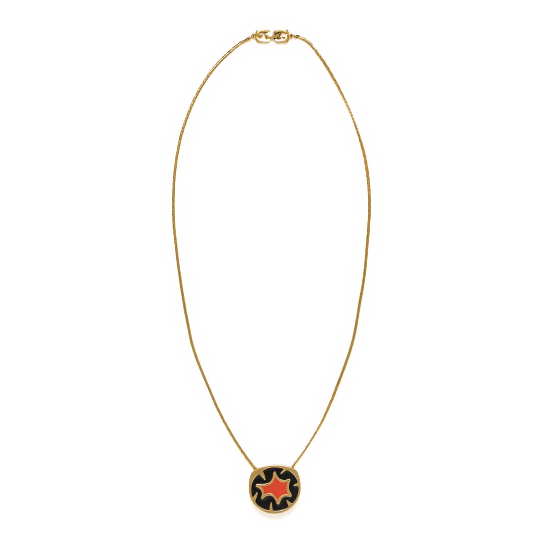 Givenchy, Pendant Necklace, 1980: Givenchy, Pendant Necklace, 1980 Pendant necklace with a gold-tone metal chain and a black & red enameled circular pendant. Fold-over clasp. Stamped at clasp and at back of pendant. Label: Givenchy