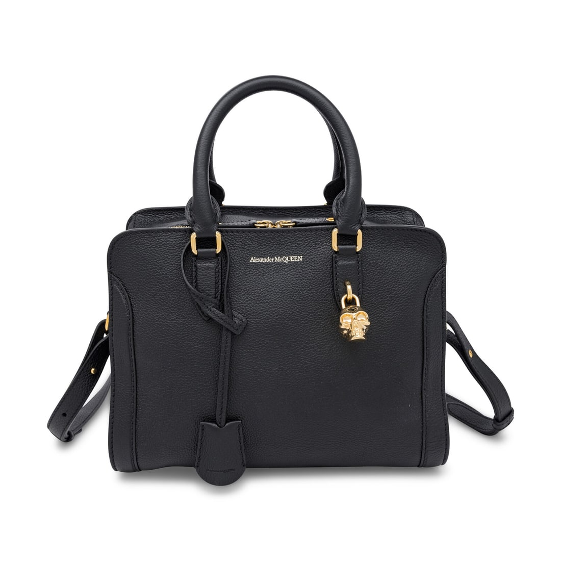 Alexander McQueen, Skull Padlock Bag: Alexander McQueen, Skull Padlock Bag Skull Padlock bag in black grained leather with gold-tone hardware. Locking double zip closure, rolled leather handles, and removable flat leather strap. Label: