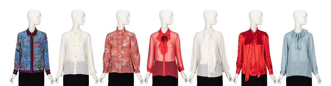 Gucci, Group of Seven Silk Blouses: Gucci, Group of Seven Silk Blouses THE FIRST Button-up blouse in Flora-printed blue silk crÍpe de chine with navy & red grosgrain ribbon trim throughout. Spread collar. Light padding at