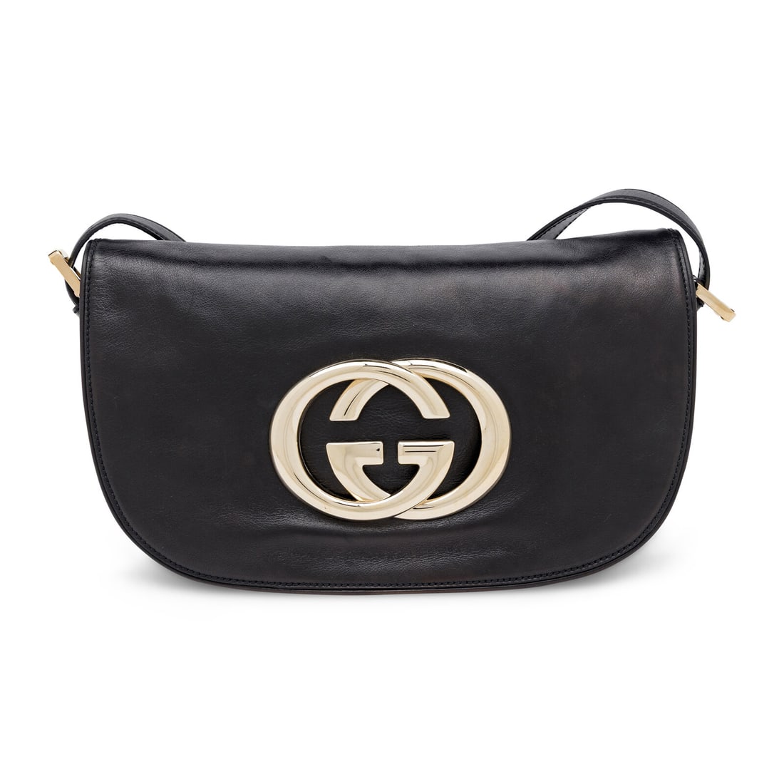 Gucci, Britt Flap Bag in Black Leather: Gucci, Britt Flap Bag in Black Leather Britt flap bag in black leather with light gold-tone hardware. Snap closure and adjustable flat leather strap. Label: Gucci Style/Serial No.: 161727 204046