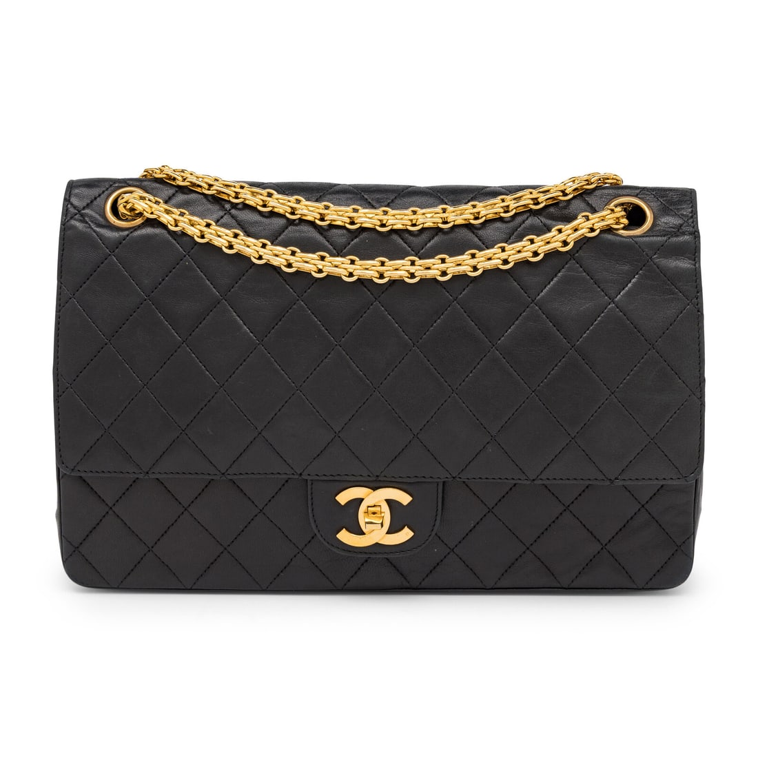 Chanel, Medium Classic Double Flap in Quilted Black Leather: Chanel, Medium Classic Double Flap in Quilted Black Leather Medium classic flap shoulder bag in matelassÈ-quilted black lambskin leather with 24k gold-plated hardware. CC turn-lock closure and Ma