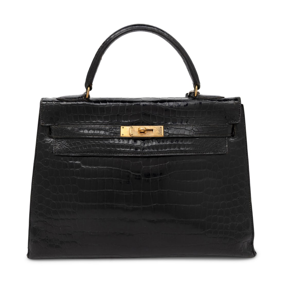 Vintage Hermès, Kelly 32 in Noir Alligator: Vintage Hermès, Kelly 32 in Noir Alligator Kelly 32 Sellier in Noir Alligator leather with gold-plated hardware. Label: Hermès Stamp: Unmarked Date: 20th Century, likely 1935-1945 Country of Origin: