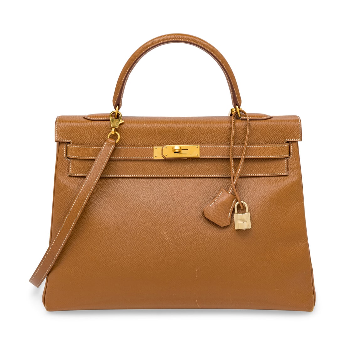Hermès, Kelly 35 in Gold Epsom: Hermès, Kelly 35 in Gold Epsom Kelly 35 Retourne in Gold Epsom leather with gold-plated hardware. Includes shoulder strap. Label: Hermès Stamp: B in Square Date: 1998 Country of Origin: France Count