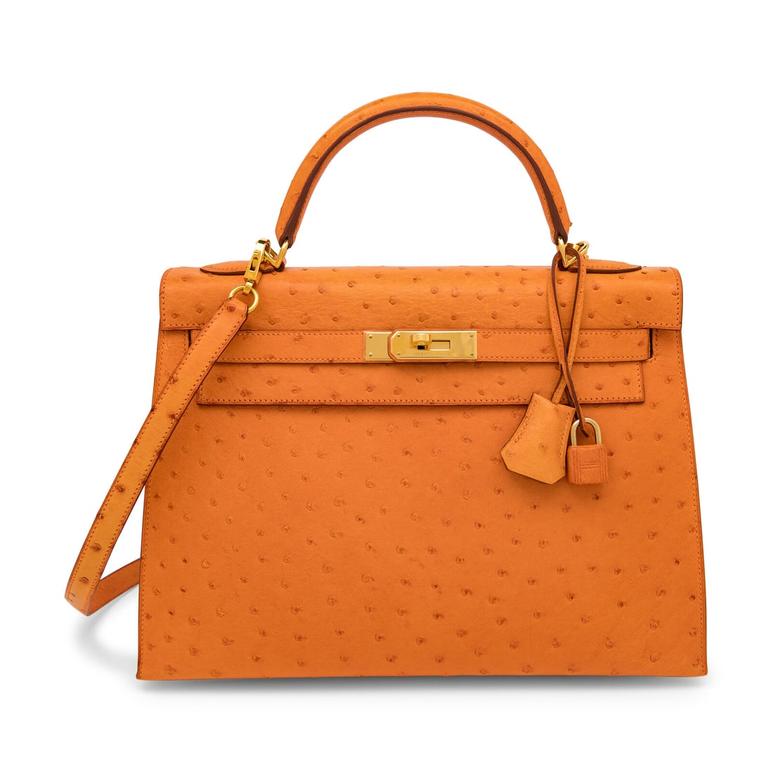 Hermès, Kelly 32 in Abricot Ostrich: Hermès, Kelly 32 in Abricot Ostrich Kelly 32 Sellier in Abricot ostrich leather with gold-plated hardware. Label: Hermès Stamp: F in Square Date: 2002 Country of Origin: France Approximate Measureme