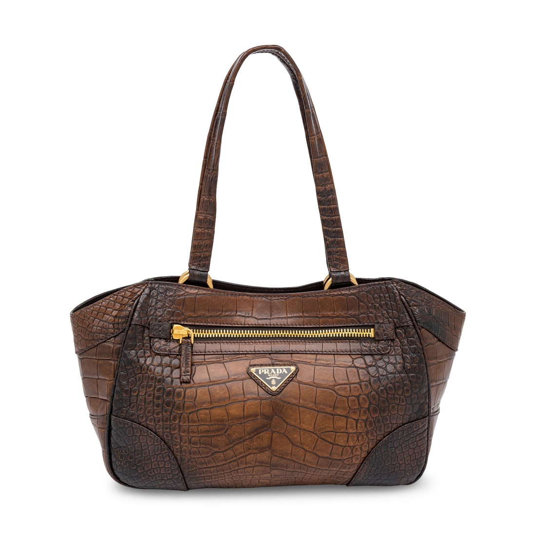 Prada, Tote in Brown Crocodile: Prada, Tote in Brown Crocodile Tote bag in aged brown crocodile skin with gold-tone hardware. Magnetic snap closure and flat leather straps. Label: Prada Style/Serial No.: Unmarked Date: 2000's Countr