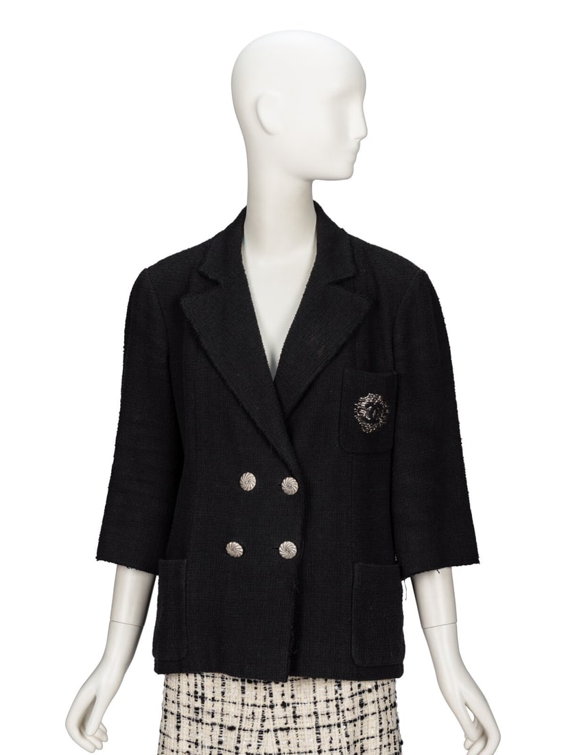 Chanel, Black Tweed Blazer: Chanel, Black Tweed Blazer Blazer in black cotton bouclÈ tweed with unfinished lightly frayed edges. Notched lapels. Elbow-length set-in sleeves. Two patch pockets at front; one chest patch