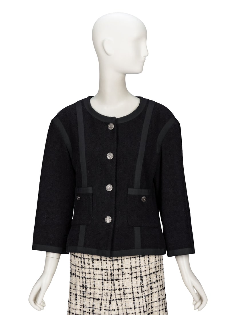 Chanel, Black Tweed Cardigan Jacket: Chanel, Black Tweed Cardigan Jacket Cardigan jacket in black cotton bouclÈ tweed with black grosgrain ribbon trim throughout. Round collarless neckline. Slightly dropped shoulder seams.