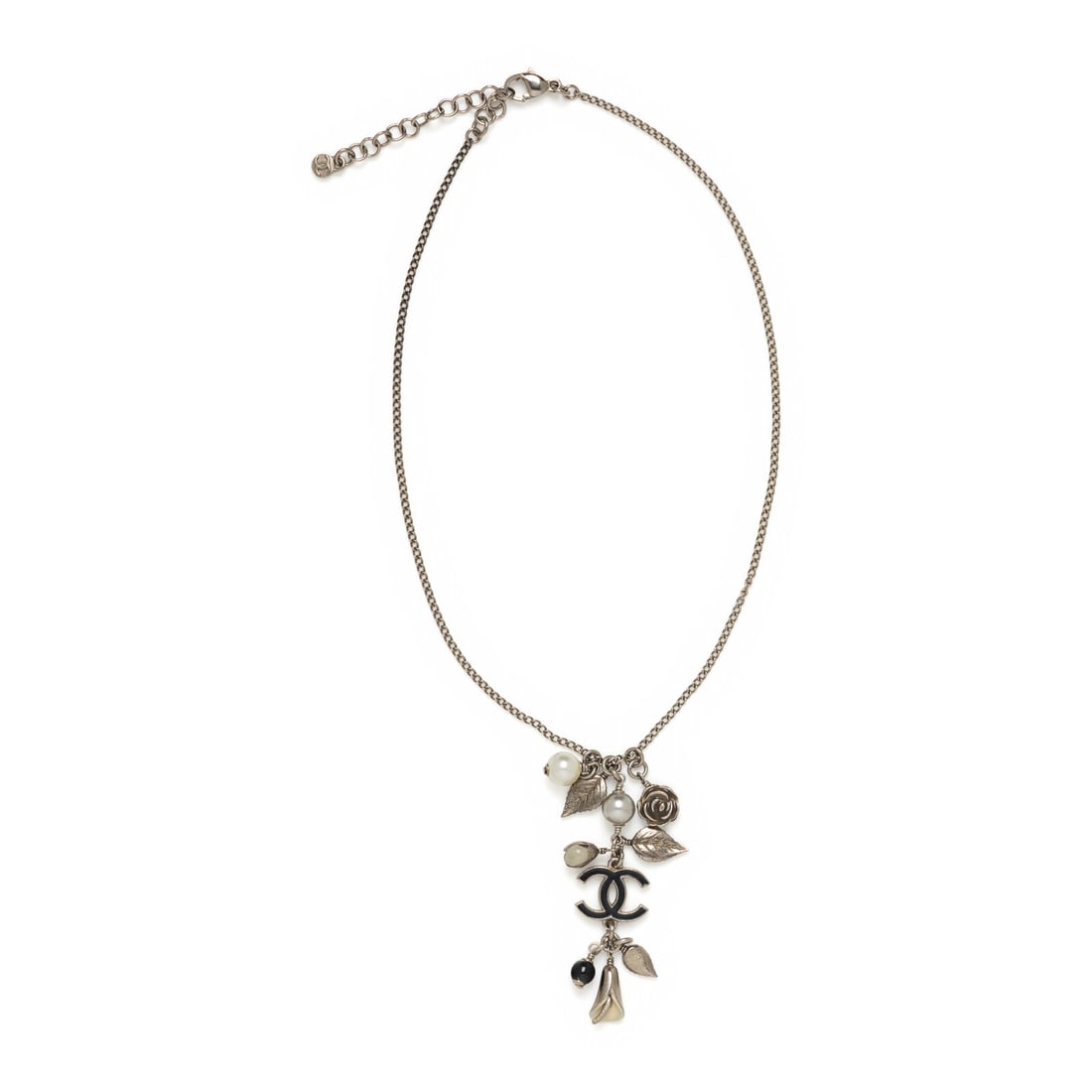 Chanel, Floral Charm Necklace: Chanel, Floral Charm Necklace Charm necklace in aged silver-tone metal. Features floral metal charms, faux pearl beads, and an enameled CC logo charm. Lobster clasp closure. Label: Chanel Date: F/W 20