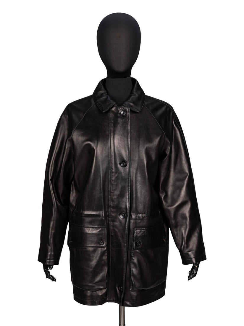 Lora Piana, Black Nappa Leather Coat: Lora Piana, Black Nappa Leather Coat Hip-length coat in shiny black nappa leather. Spread collar. Full-length raglan sleeves. Two buttoned patch pockets at front and two slit pockets at front; one