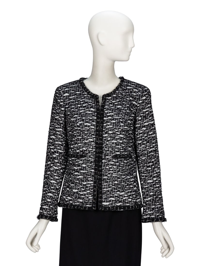 Chanel, Black & White Tweed Jacket: Chanel, Black & White Tweed Jacket Cardigan jacket in black & white wool-blend fantasy tweed with woven glittery trim throughout. Round collarless neckline. Light padding at shoulders. Full-length set