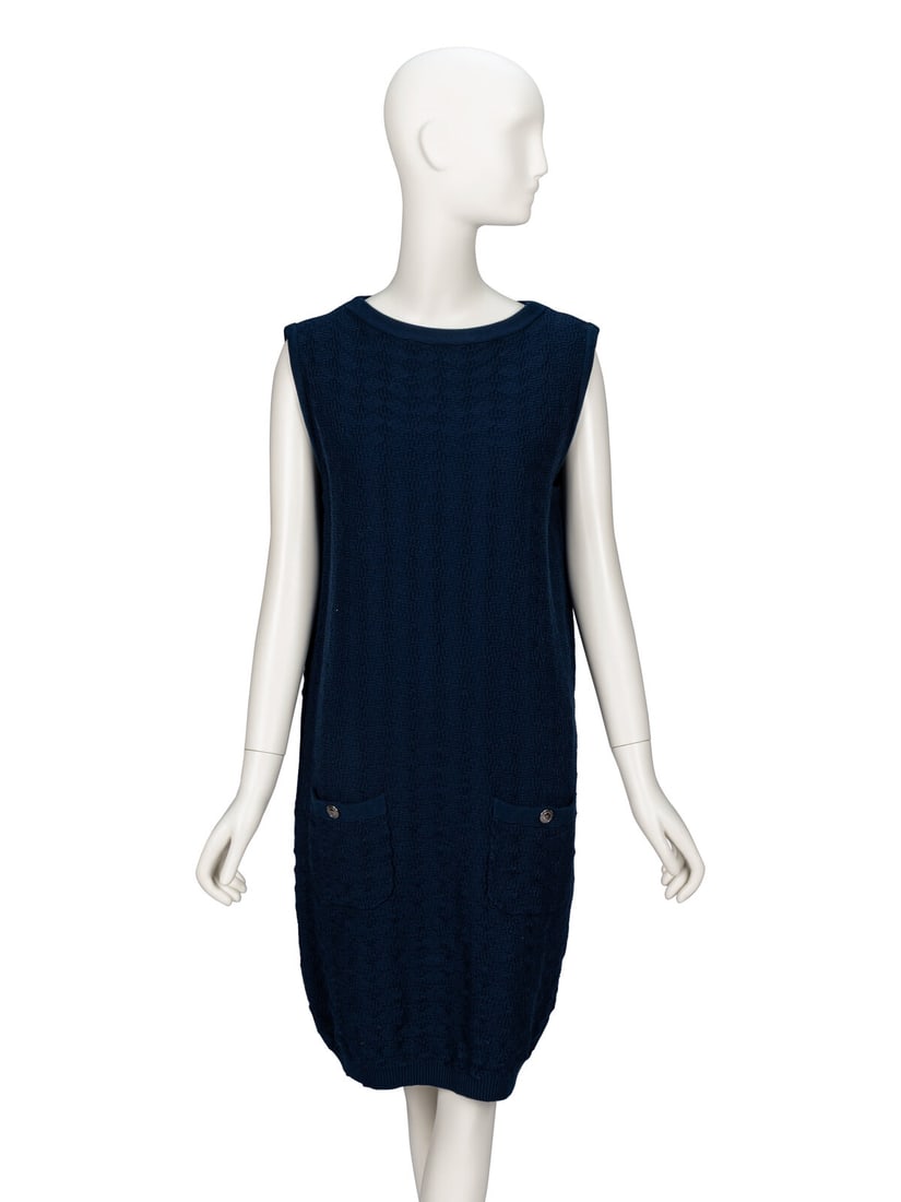 Chanel, Navy Sleeveless Knit Dress: Chanel, Navy Sleeveless Knit Dress Sleeveless shift dress in navy cotton jacquard knit; moderate stretch content. Wide collarless neckline. Keyhole at back neckline with decorative button. Two