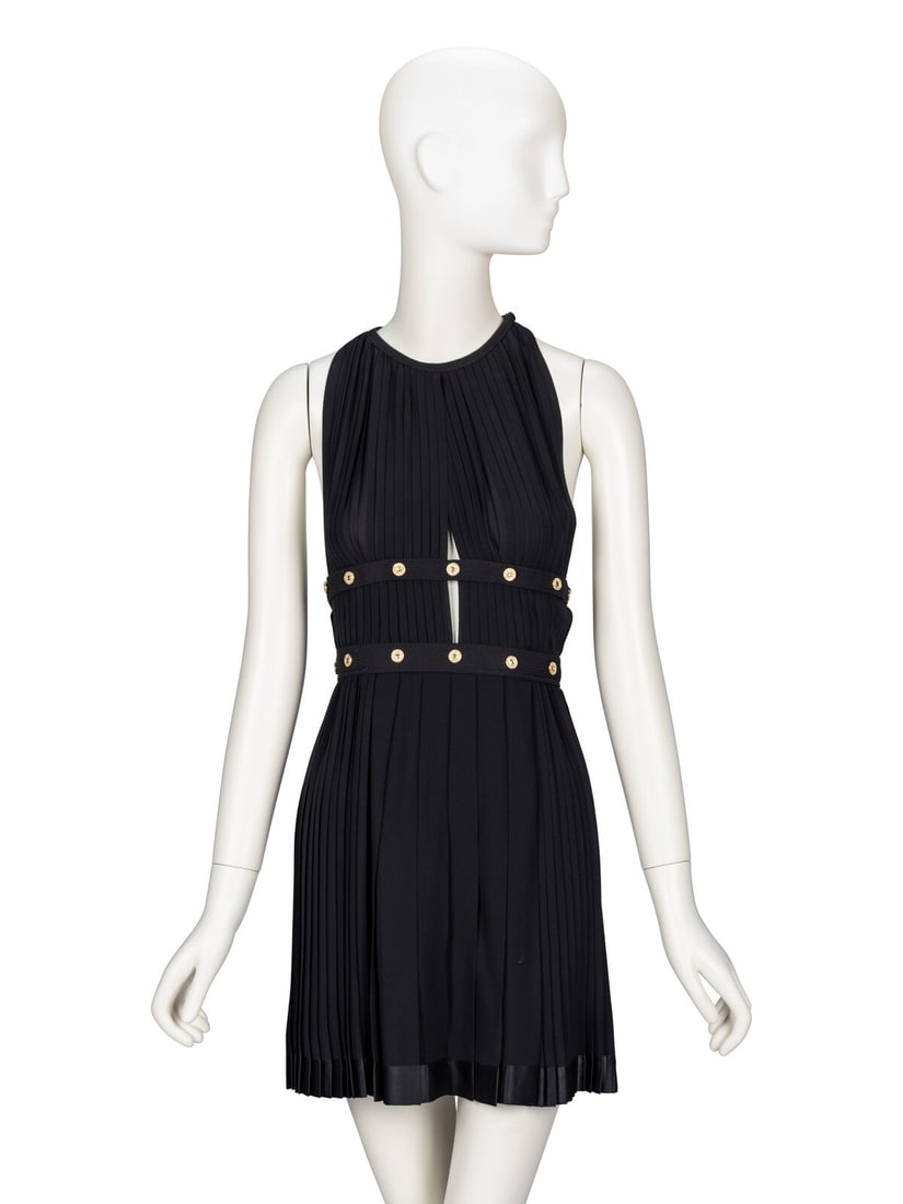 Gianni Versace, Pleated Silk Minidress, 1991: Gianni Versace, Pleated Silk Minidress, 1991 Sleeveless minidress in knife-pleated black silk crÍpe with black satin trim throughout. Halter neckline. Open bodice sides with topstitched horizonta