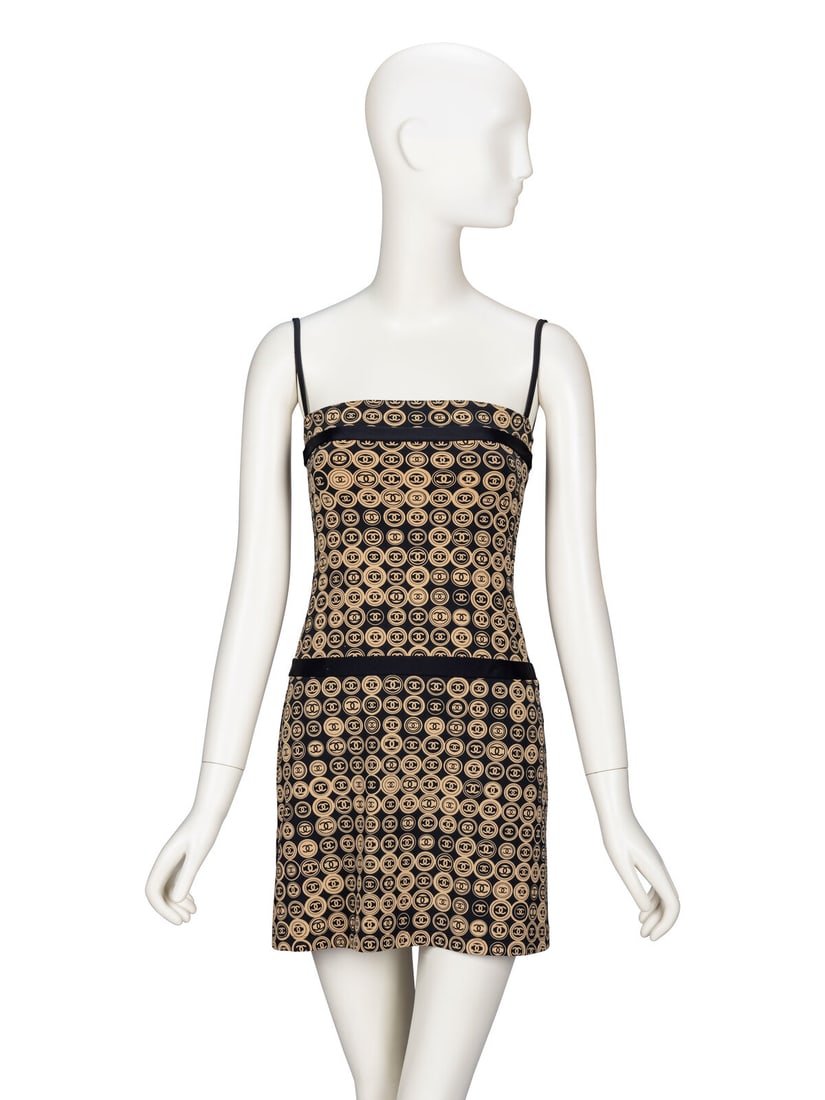 Chanel, CC Logo Dress: Chanel, CC Logo Dress Minidress in tan & black CC logo-print stretch-blend nylon knit. Flat neckline. Black spaghetti straps. Inset black bands at bust and hips. Mid-thigh-length straight skirt. No cl