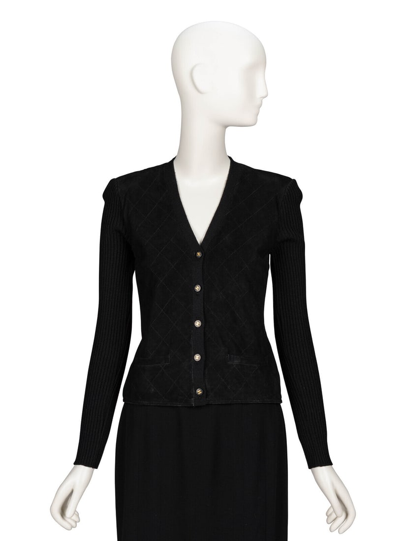 Chanel, Black Suede & Knit Cardigan: Chanel, Black Suede & Knit Cardigan Fitted cardigan-style top in ribbed black wool knit with diamond-topstitched black lambskin suede front panels. Deep V neckline. Padding at shoulders. Full-length f