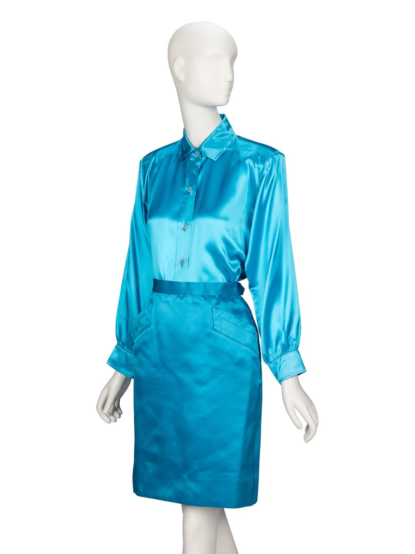 Saint Laurent Rive Gauche, Aqua Satin Skirt Ensemble: Saint Laurent Rive Gauche, Aqua Satin Skirt Ensemble BLOUSE Button-up blouse in aqua charmeuse. Spread collar. Yoke details and padding at shoulders. Full-length set-in sleeves with buttoned shirt cuf
