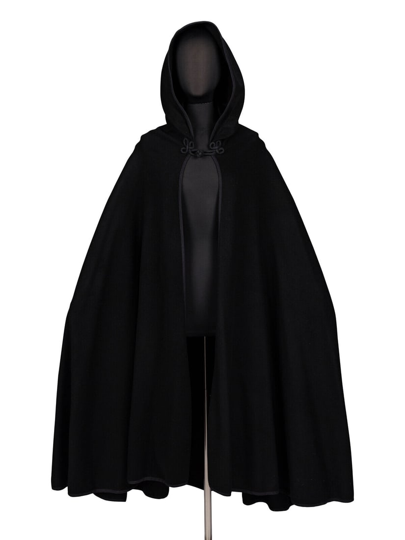 Calvin Klein, Hooded Wool Cape, c. 1970's: Calvin Klein, Hooded Wool Cape, c. 1970's Full-length circle cape in felted black wool twill with woven binding trim at edges. Large hood with hanging tassel at point. Braided cord frog closure at