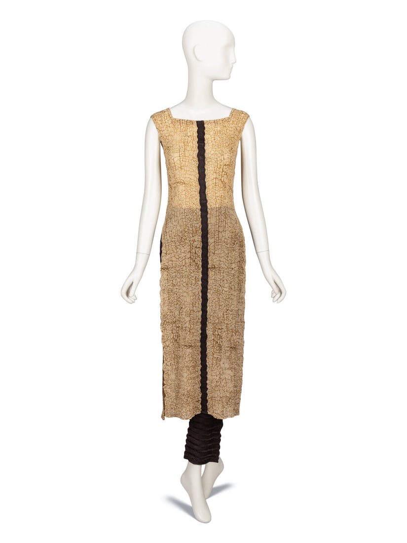 Issey Miyake, Pleated Tunic & Pant Ensemble: Issey Miyake, Pleated Tunic & Pant Ensemble TOP Sleeveless tunic in tan abstract-print zig zag-pleated polyester with a brown satin stripe inset at front & back. High stretch content from pleating.