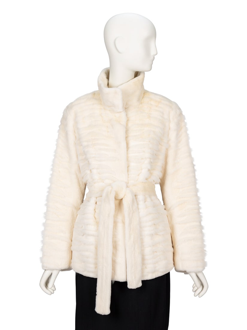 Mila Schàn, Belted Sheared Mink White Jacket: Mila Schˆn, Belted Sheared Mink White Jacket Hip-length jacket in white textured & sheared mink. Convertible stand/spread collar with reinforced edges. Full-length sleeves. Two in-seam pockets