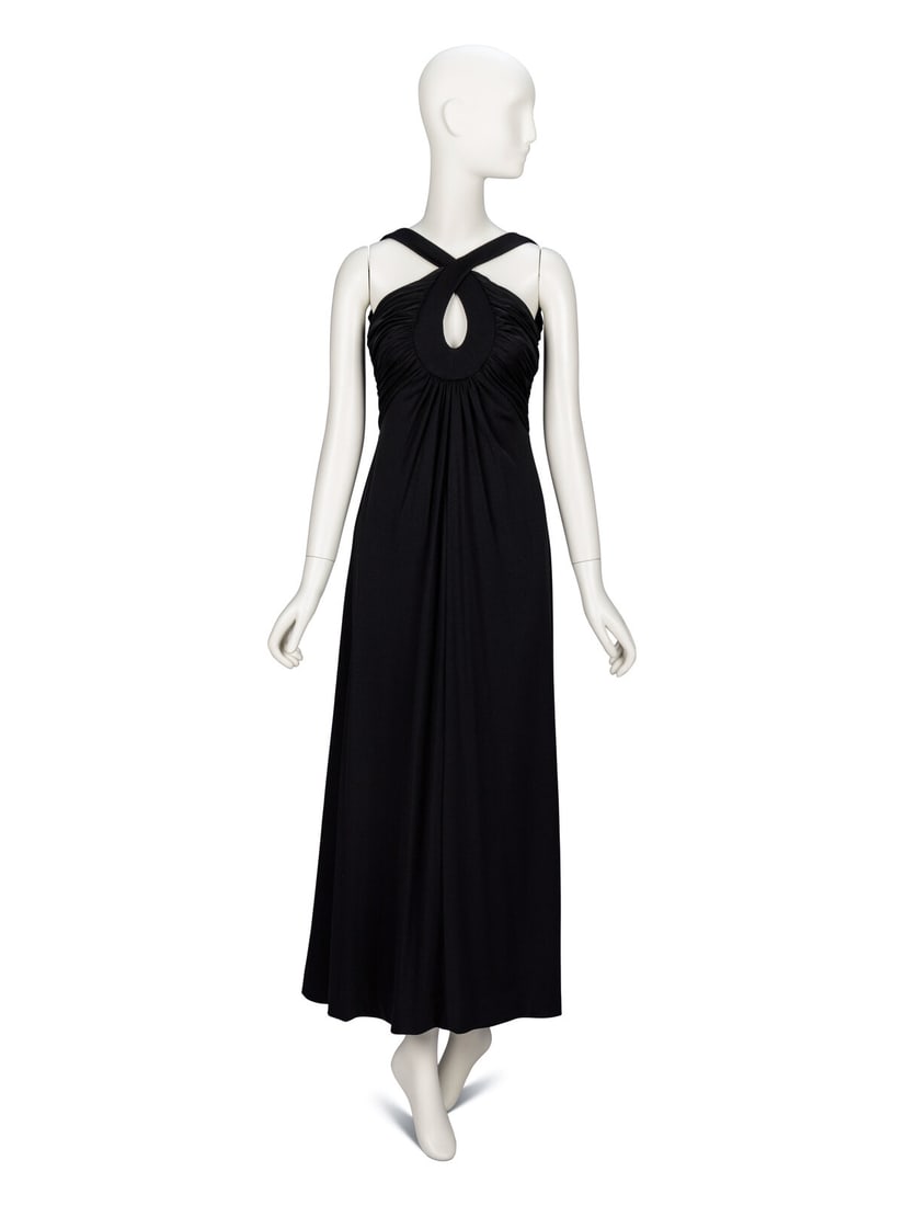 Estévez, Black Jersey Halter Dress: Estévez, Black Jersey Halter Dress Sleeveless evening dress in black stretch jersey. Halter neckline with crossed straps and a keyhole cutout at center of chest. Low-cut rounded neckline at back.
