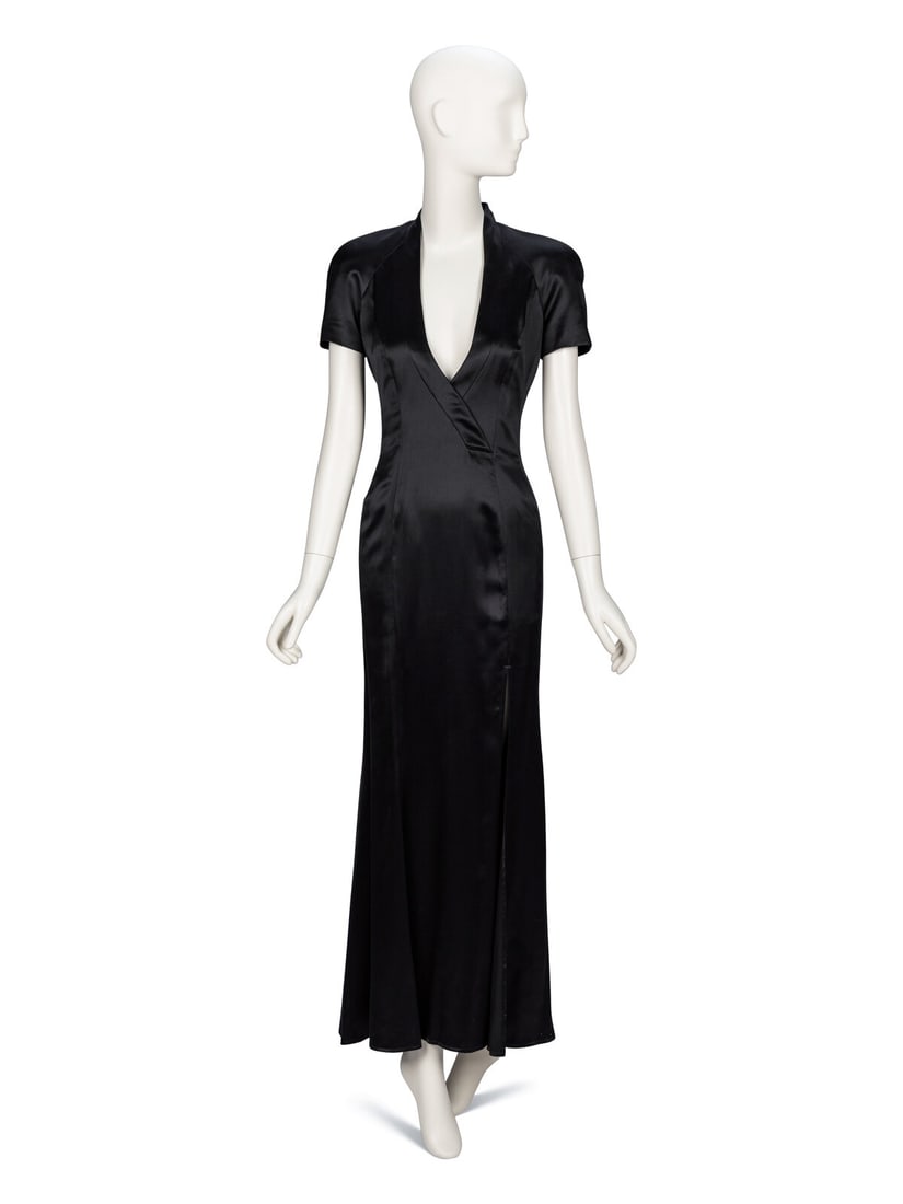Gianfranco Ferré, Black Charmeuse Evening Gown: Gianfranco Ferré, Black Charmeuse Evening Gown Sheath gown in black viscose/silk-blend charmeuse. Plunging V neckline with stand collar. Padding at shoulders. Short raglan sleeves. Fitted at waist.