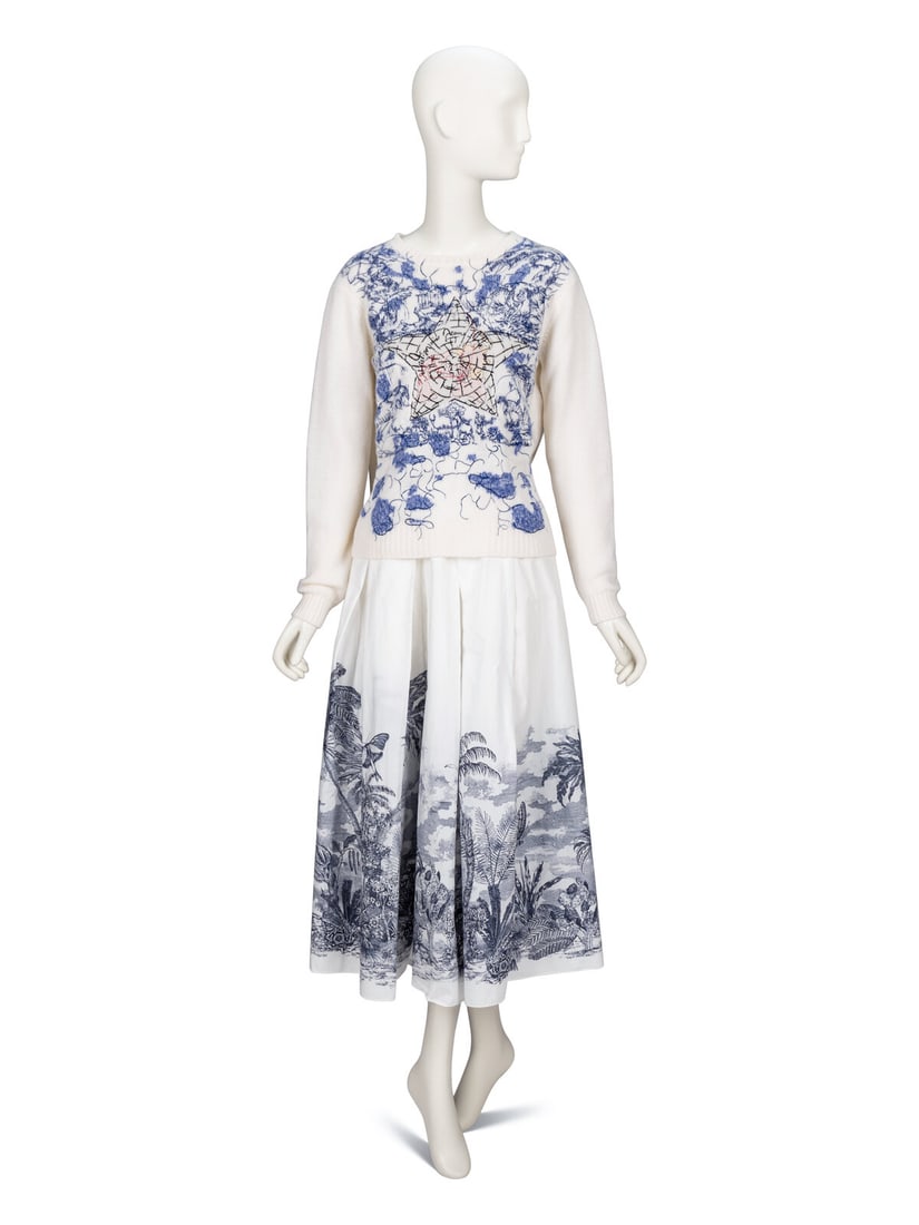 Christian Dior, Embroidered Sweater & Printed Skirt: Christian Dior, Embroidered Sweater & Printed Skirt SWEATER "Around The World" sweater in off-white cashmere knit with all-over embroideries. Round crew neck neckline. Full-length sleeves. Unlined.