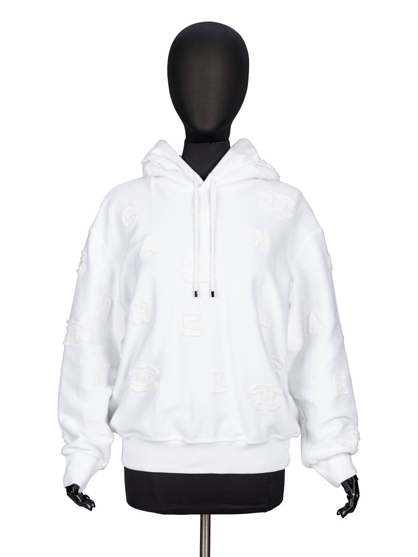 Chanel, White Appliquéd Hoodie: Chanel, White Appliquéd Hoodie Hooded sweatshirt in reversed white cotton sweatshirt knit with appliquéd letters throughout. Large hood with drawstrings. Full-length sleeves with ribbed knit trim